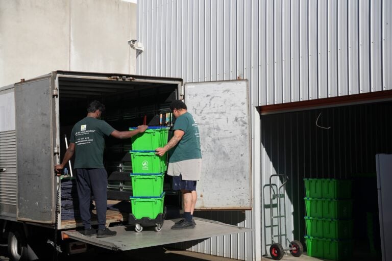 Pack My Home movers wrapping and protecting furniture for transport