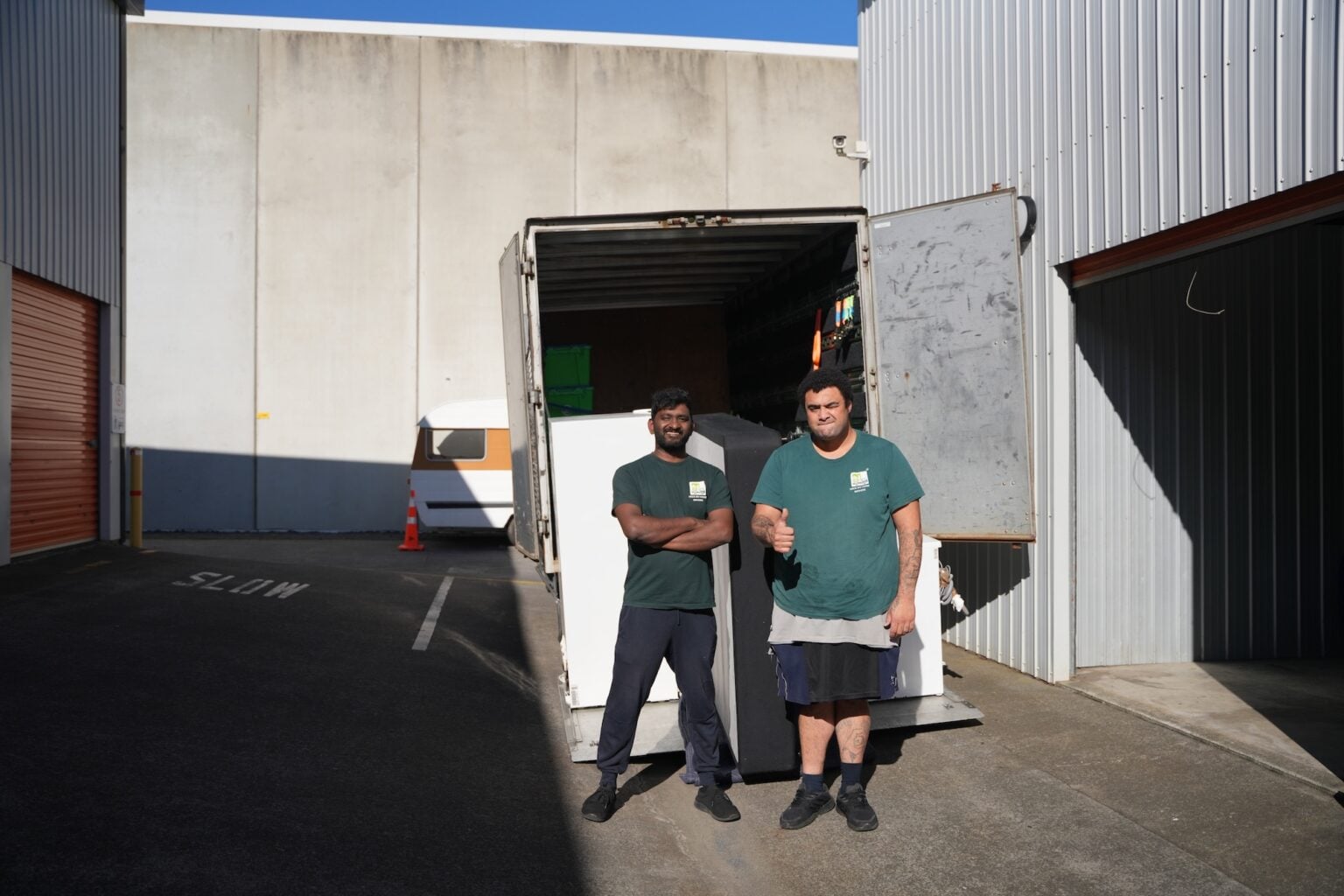 Pack My Home movers loading furniture into a moving truck in Auckland